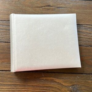 Mini silver scrapbook with photo holders and place for details